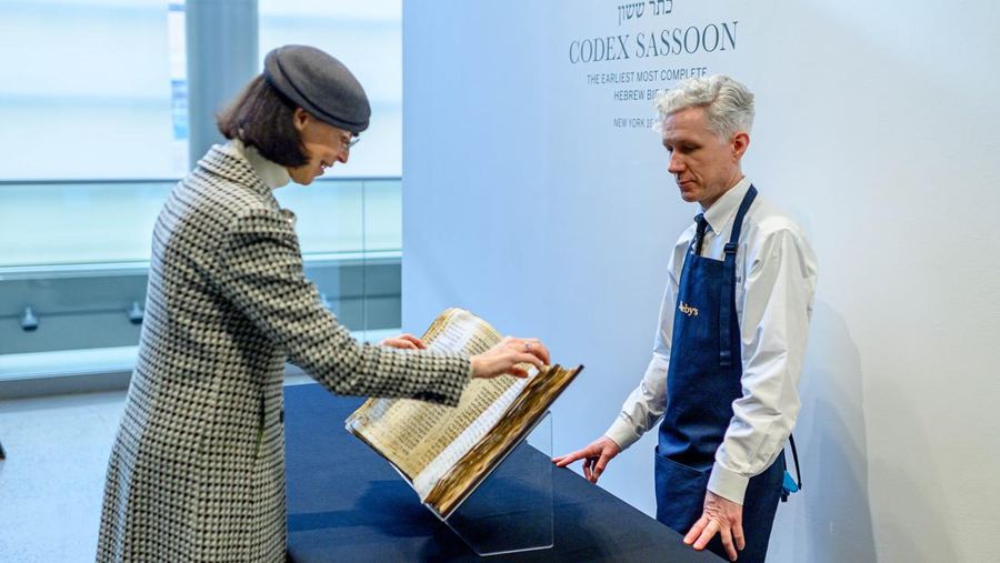 NEW YORK, NEW YORK - FEBRUARY 15:  A view of the Codex Sassoon at Sotheby's on February 15, 2023 in New York City. The codex is the oldest surviving Hebrew Bible or Tanakh as its used today in contrast to the dead sea scrolls which are older but the books are in separate scrolls. The Book is approximately 1000 years old and is estimated to be auctioned at 30-50 Million dollars and that would make it the most valuable historical document to appear in auction. (Photo by Roy Rochlin/Getty Images)