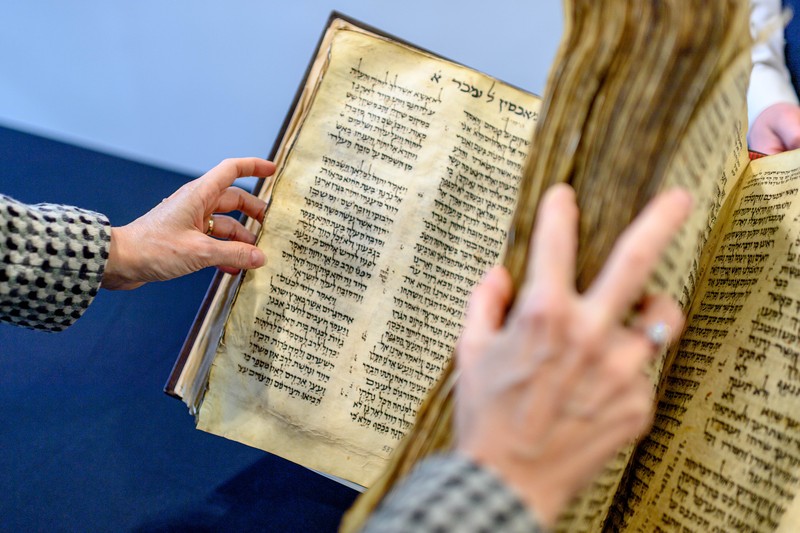 NEW YORK, NEW YORK - FEBRUARY 15:  A view of the Codex Sassoon at Sotheby's on February 15, 2023 in New York City. The codex is the oldest surviving Hebrew Bible or Tanakh as its used today in contrast to the dead sea scrolls which are older but the books are in separate scrolls. The Book is approximately 1000 years old and is estimated to be auctioned at 30-50 Million dollars and that would make it the most valuable historical document to appear in auction. (Photo by Roy Rochlin/Getty Images)