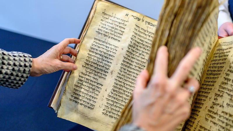 NEW YORK, NEW YORK - FEBRUARY 15:  A view of the Codex Sassoon at Sotheby's on February 15, 2023 in New York City. The codex is the oldest surviving Hebrew Bible or Tanakh as its used today in contrast to the dead sea scrolls which are older but the books are in separate scrolls. The Book is approximately 1000 years old and is estimated to be auctioned at 30-50 Million dollars and that would make it the most valuable historical document to appear in auction. (Photo by Roy Rochlin/Getty Images)