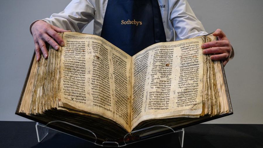 NEW YORK, NEW YORK - FEBRUARY 15:  A view of the Codex Sassoon at Sotheby's on February 15, 2023 in New York City. The codex is the oldest surviving Hebrew Bible or Tanakh as its used today in contrast to the dead sea scrolls which are older but the books are in separate scrolls. The Book is approximately 1000 years old and is estimated to be auctioned at 30-50 Million dollars and that would make it the most valuable historical document to appear in auction. (Photo by Roy Rochlin/Getty Images)