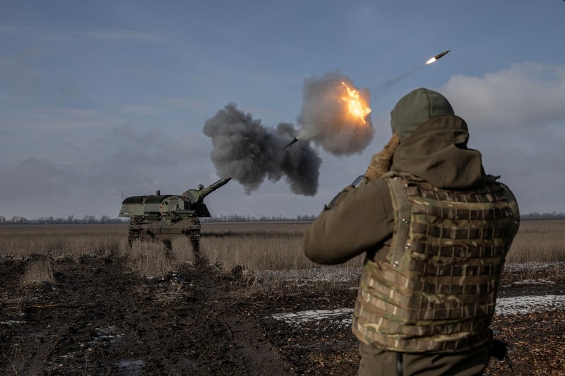 Ukrainian service members fire a SPG-9 anti-tank grenade launcher toward Russian troops in the frontline town of Bakhmut, amid Russia’s attack on Ukraine, in Donetsk region, Ukraine, in this handout picture released February 13, 2023. Iryna Rybakova/Press Service of the 93rd Independent Kholodnyi Yar Mechanized Brigade of the Ukrainian Armed Forces/Handout via REUTERS ATTENTION EDITORS - THIS IMAGE HAS BEEN SUPPLIED BY A THIRD PARTY.