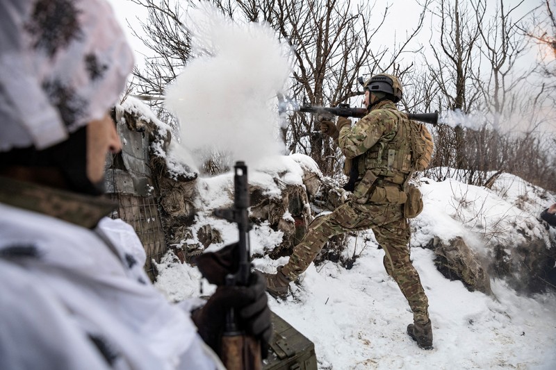 Ukrainian service members fire a SPG-9 anti-tank grenade launcher toward Russian troops in the frontline town of Bakhmut, amid Russia’s attack on Ukraine, in Donetsk region, Ukraine, in this handout picture released February 13, 2023. Iryna Rybakova/Press Service of the 93rd Independent Kholodnyi Yar Mechanized Brigade of the Ukrainian Armed Forces/Handout via REUTERS ATTENTION EDITORS - THIS IMAGE HAS BEEN SUPPLIED BY A THIRD PARTY.