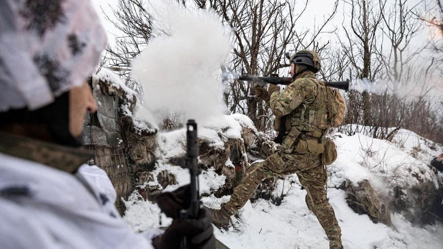 Ukrainian service members fire a SPG-9 anti-tank grenade launcher toward Russian troops in the frontline town of Bakhmut, amid Russia’s attack on Ukraine, in Donetsk region, Ukraine, in this handout picture released February 13, 2023. Iryna Rybakova/Press Service of the 93rd Independent Kholodnyi Yar Mechanized Brigade of the Ukrainian Armed Forces/Handout via REUTERS ATTENTION EDITORS - THIS IMAGE HAS BEEN SUPPLIED BY A THIRD PARTY.