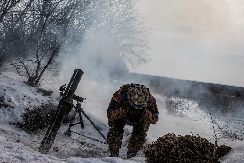 Ukrainian service members fire a SPG-9 anti-tank grenade launcher toward Russian troops in the frontline town of Bakhmut, amid Russia’s attack on Ukraine, in Donetsk region, Ukraine, in this handout picture released February 13, 2023. Iryna Rybakova/Press Service of the 93rd Independent Kholodnyi Yar Mechanized Brigade of the Ukrainian Armed Forces/Handout via REUTERS ATTENTION EDITORS - THIS IMAGE HAS BEEN SUPPLIED BY A THIRD PARTY.