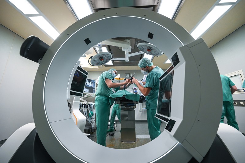15 February 2023, Saxony-Anhalt, Halle (Saale): A robotic arm as a new assistant in the operating room. The Bergmannstrost Hospital in Halle is putting a new robotic surgical operating system into operation. It also features a 3D imaging robot and a digital navigation system. Photo: Heiko Rebsch/dpa (Photo by Heiko Rebsch/picture alliance via Getty Images)