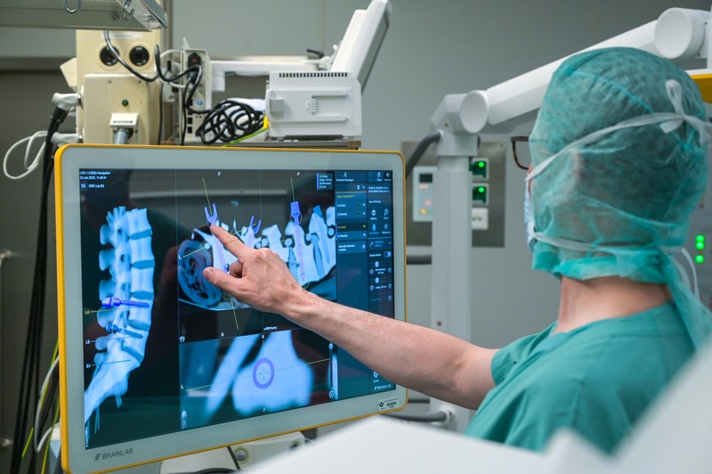 15 February 2023, Saxony-Anhalt, Halle (Saale): A robotic arm as a new assistant in the operating room. The Bergmannstrost Hospital in Halle is putting a new robotic surgical operating system into operation. It also features a 3D imaging robot and a digital navigation system. Photo: Heiko Rebsch/dpa (Photo by Heiko Rebsch/picture alliance via Getty Images)