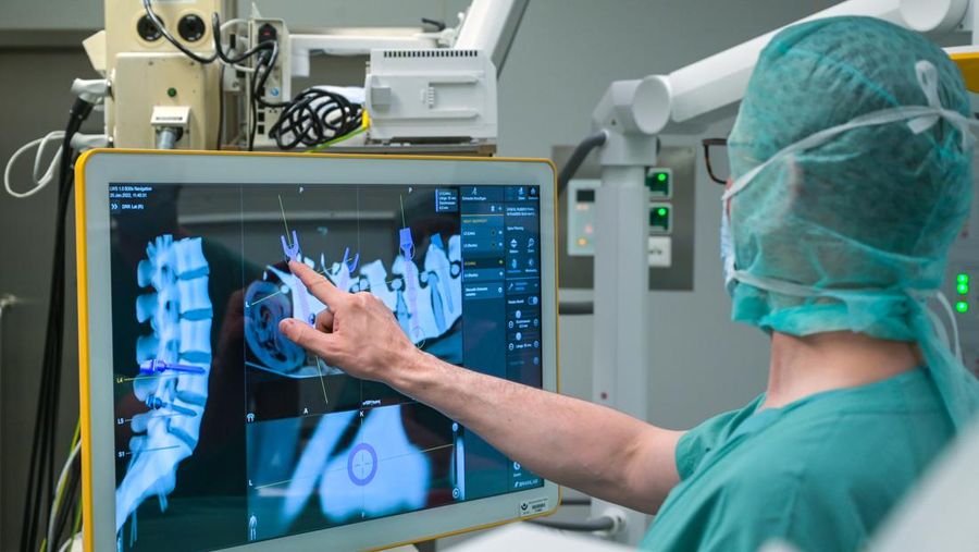 15 February 2023, Saxony-Anhalt, Halle (Saale): A robotic arm as a new assistant in the operating room. The Bergmannstrost Hospital in Halle is putting a new robotic surgical operating system into operation. It also features a 3D imaging robot and a digital navigation system. Photo: Heiko Rebsch/dpa (Photo by Heiko Rebsch/picture alliance via Getty Images)