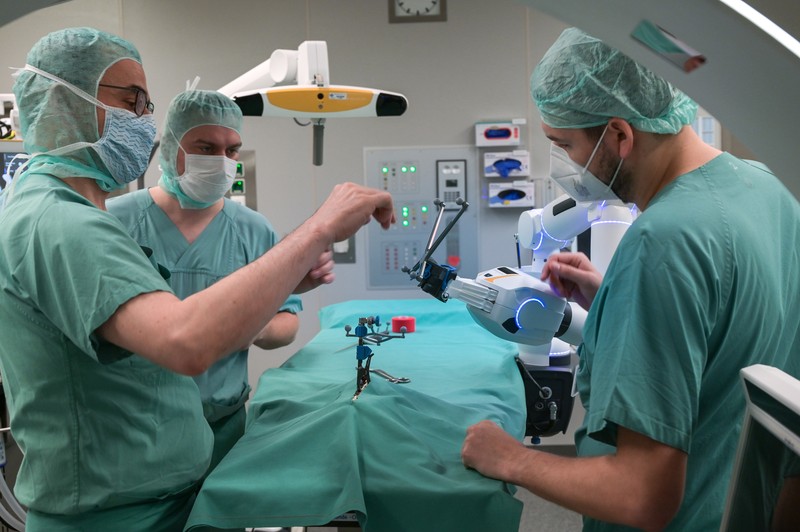 15 February 2023, Saxony-Anhalt, Halle (Saale): A robotic arm as a new assistant in the operating room. The Bergmannstrost Hospital in Halle is putting a new robotic surgical operating system into operation. It also features a 3D imaging robot and a digital navigation system. Photo: Heiko Rebsch/dpa (Photo by Heiko Rebsch/picture alliance via Getty Images)