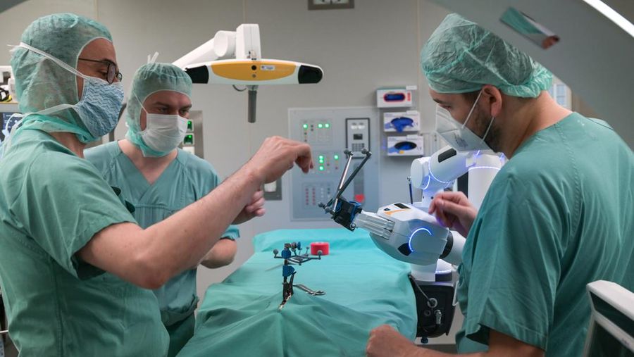 15 February 2023, Saxony-Anhalt, Halle (Saale): A robotic arm as a new assistant in the operating room. The Bergmannstrost Hospital in Halle is putting a new robotic surgical operating system into operation. It also features a 3D imaging robot and a digital navigation system. Photo: Heiko Rebsch/dpa (Photo by Heiko Rebsch/picture alliance via Getty Images)