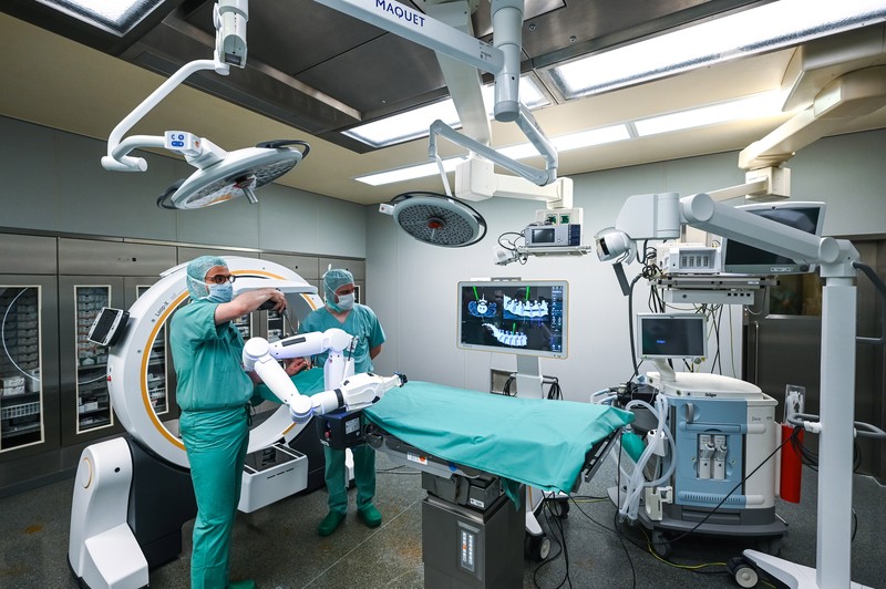 15 February 2023, Saxony-Anhalt, Halle (Saale): A robotic arm as a new assistant in the operating room. The Bergmannstrost Hospital in Halle is putting a new robotic surgical operating system into operation. It also features a 3D imaging robot and a digital navigation system. Photo: Heiko Rebsch/dpa (Photo by Heiko Rebsch/picture alliance via Getty Images)