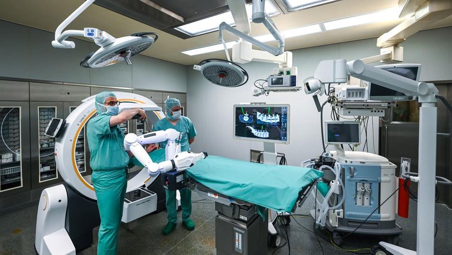 15 February 2023, Saxony-Anhalt, Halle (Saale): A robotic arm as a new assistant in the operating room. The Bergmannstrost Hospital in Halle is putting a new robotic surgical operating system into operation. It also features a 3D imaging robot and a digital navigation system. Photo: Heiko Rebsch/dpa (Photo by Heiko Rebsch/picture alliance via Getty Images)