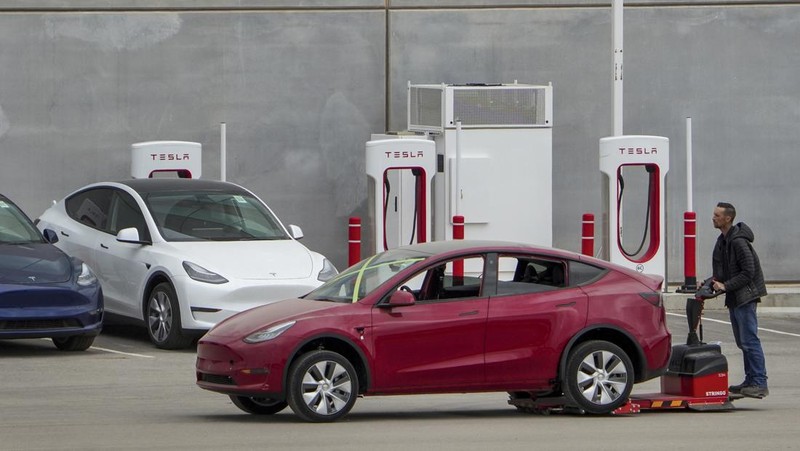 Tesla cars sit at Tesla's Giga Texas automotive manufacturing facility in Austin, Texas, on Thursday, Feb. 16, 2023. U.S. safety regulators have pressured Tesla into recalling nearly 363,000 vehicles with its “Full Self-Driving” system because it misbehaves around intersections and doesn't always follow speed limits.  (Jay Janner/Austin American-Statesman via AP)
