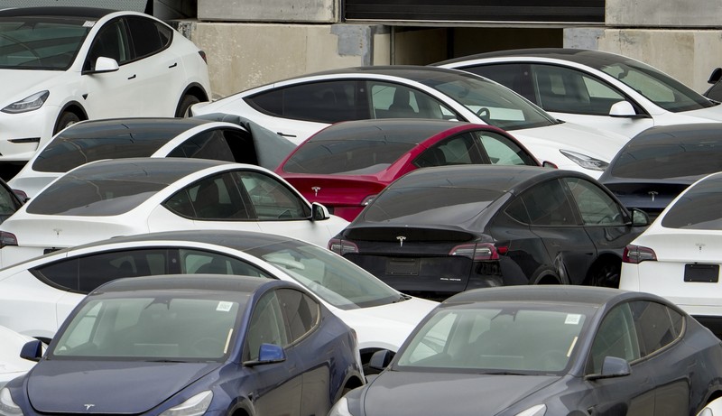 Tesla cars sit at Tesla's Giga Texas automotive manufacturing facility in Austin, Texas, on Thursday, Feb. 16, 2023. U.S. safety regulators have pressured Tesla into recalling nearly 363,000 vehicles with its “Full Self-Driving” system because it misbehaves around intersections and doesn't always follow speed limits.  (Jay Janner/Austin American-Statesman via AP)