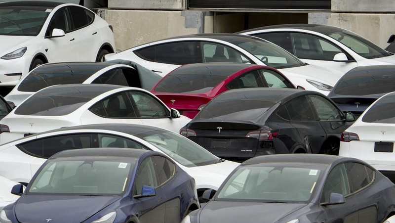 Tesla cars sit at Tesla's Giga Texas automotive manufacturing facility in Austin, Texas, on Thursday, Feb. 16, 2023. U.S. safety regulators have pressured Tesla into recalling nearly 363,000 vehicles with its “Full Self-Driving” system because it misbehaves around intersections and doesn't always follow speed limits.  (Jay Janner/Austin American-Statesman via AP)