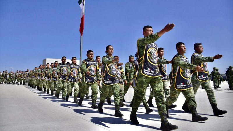 Soldiers do an honor guard during the homage to rescue dog Proteo, who died during the rescue efforts in the town of Adiyaman, Turkey, at the Santa Lucia Air Force Base in Zumpango, Mexico, February 16, 2023. National Defense Secretary (SEDENA)/Handout via REUTERS THIS IMAGE HAS BEEN SUPPLIED BY A THIRD PARTY. NO RESALES. NO ARCHIVES