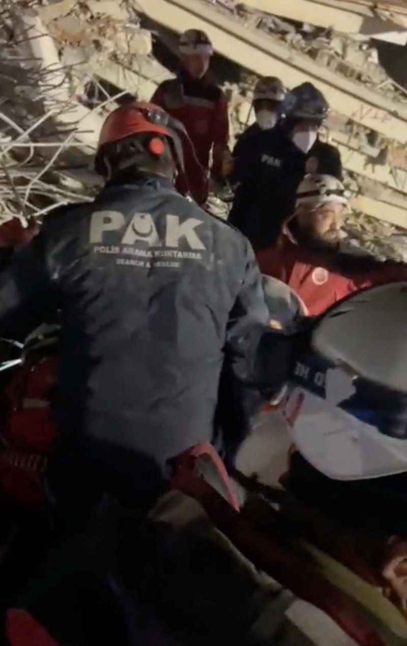 Members of the Polis Arama Kurtarma (PAK) work as they rescue a 12-year-old boy from the rubble of a collapsed building, in the aftermath of a deadly earthquake, in Hatay, Turkey February 17, 2023, in this still image obtained from a social media video. Courtesy of Turkish Police Service via Twitter/via REUTERS  THIS IMAGE HAS BEEN SUPPLIED BY A THIRD PARTY. MANDATORY CREDIT.