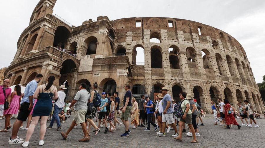 Rome. Tourists, guides, litter and fences at the Colosseum. (Photo by: Riccardo De Luca/AGF/Universal Images Group via Getty Images)