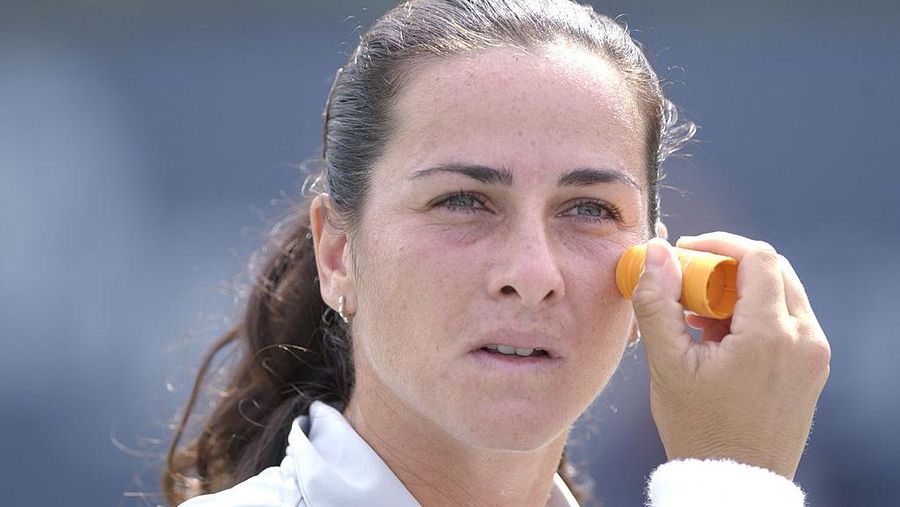28 Aug 2001: Silvia Farina Elia of Italy applies sun screen during her match with Maja Matevzic of Slovenia during the first round of the US Open at the USTA National Tennis Center, Flushing, New York. Matevzic won 6-2, 6-4. DIGITAL IMAGE Mandatory Credit: Ezra Shaw/ALLSPORT