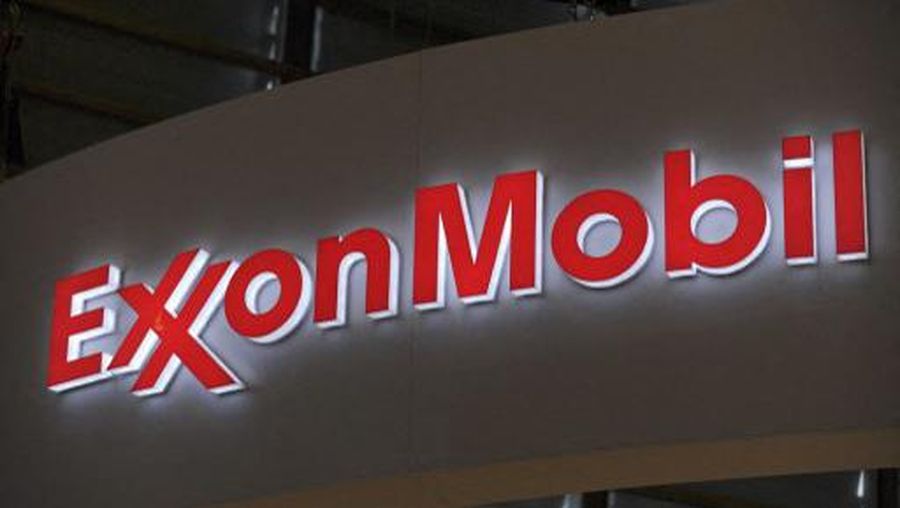 A picture shows the logo of US oil and gas giant ExxonMobil during the World Gas Conference exhibition in Paris on June 2, 2015. AFP PHOTO / ERIC PIERMONT (Photo by ERIC PIERMONT / AFP)
