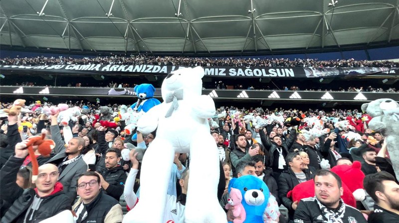 Fans throw toys on the pitch for children affected by earthquake during a Turkish Super League match between Besiktas and Antalyaspor at Vodafone Park in Istanbul, Turkey February 26, 2023. REUTERS/Stringer NO RESALES. NO ARCHIVES.