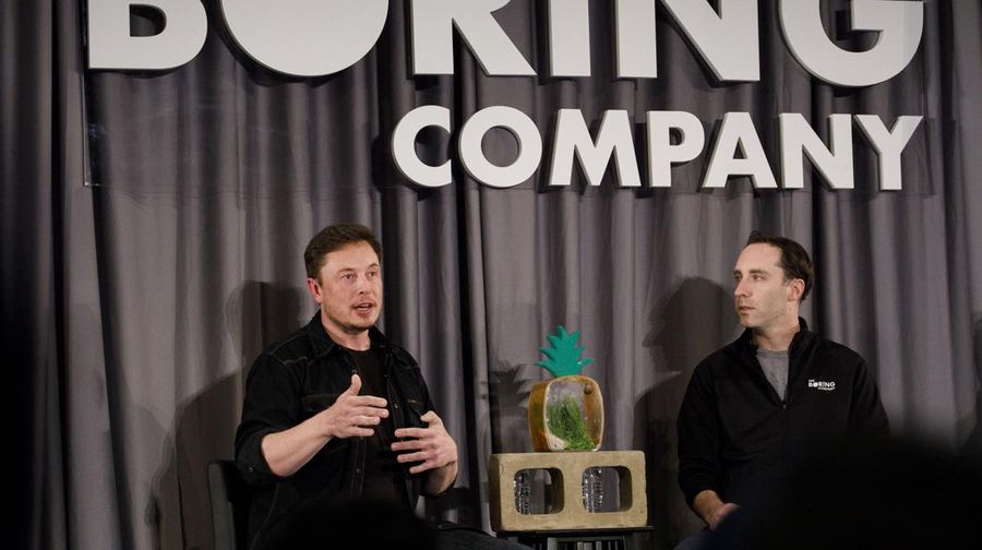 Elon Musk, co-founder and chief executive officer of Tesla Inc., left, speaks as Steve Davis, the operations head of Boring Co., listens during a Boring event in Los Angeles, California, U.S., on Thursday, May 17, 2018. Closely held SpaceX is going to build its next rocket, known as BFR, at the Port of Los Angeles, an area Musk envisions people getting to using a Boring loop -- if the city approves the idea. Photographer: Patrick T. Fallon/Bloomberg via Getty Images