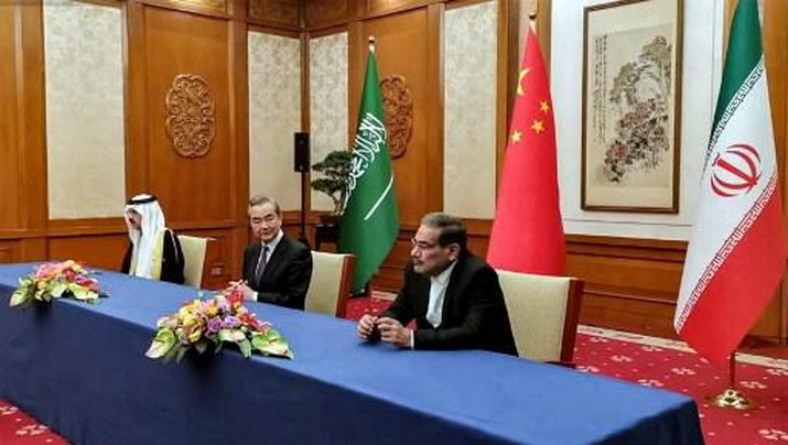 CHINA-IRAN-SAUDI-POLITICS-DIPLOMACY This handout image provided by Nournews agency shows the Secretary of the Supreme National Security Council of Iran Ali Shamkhani (R), the Director of the Office of the Central Foreign Affairs Commission of the Chinese Communist Party (CCP) Wang Yi (C), and Saudi Arabia's National Security adviser and Minister of State Musaad bin Mohammed al-Aiban (L) meeting together in Beijing on March 10, 2023. - Iran and Saudi Arabia agreed to restore ties and to reopen respective diplomatic missions after talks in China, state media in both countries reported on March 10, 2023, seven years after relations were severed. Riyadh cut ties with Tehran after Iranian protesters attacked Saudi diplomatic missions in the Islamic republic in 2016 following the Saudi execution of Shiite cleric Nimr al-Nimr. (Photo by NOURNEWS AGENCY / AFP) / == RESTRICTED TO EDITORIAL USE - MANDATORY CREDIT