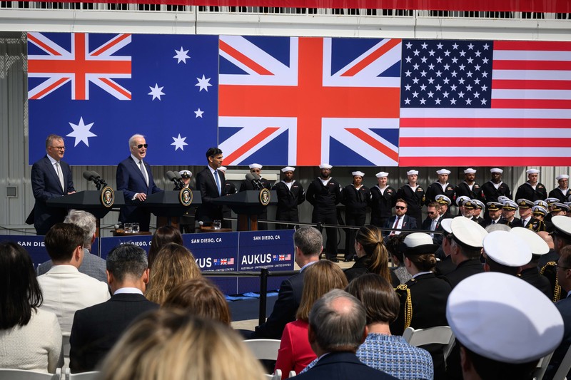 President Joe Biden arrives with Australian Prime Minister Anthony Albanese and British Prime Minister Rishi Sunak, right, for a news conference at Naval Base Point Loma, Monday, March 13, 2023, in San Diego. (AP Photo/Evan Vucci)