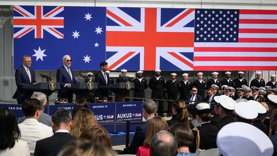 President Joe Biden arrives with Australian Prime Minister Anthony Albanese and British Prime Minister Rishi Sunak, right, for a news conference at Naval Base Point Loma, Monday, March 13, 2023, in San Diego. (AP Photo/Evan Vucci)