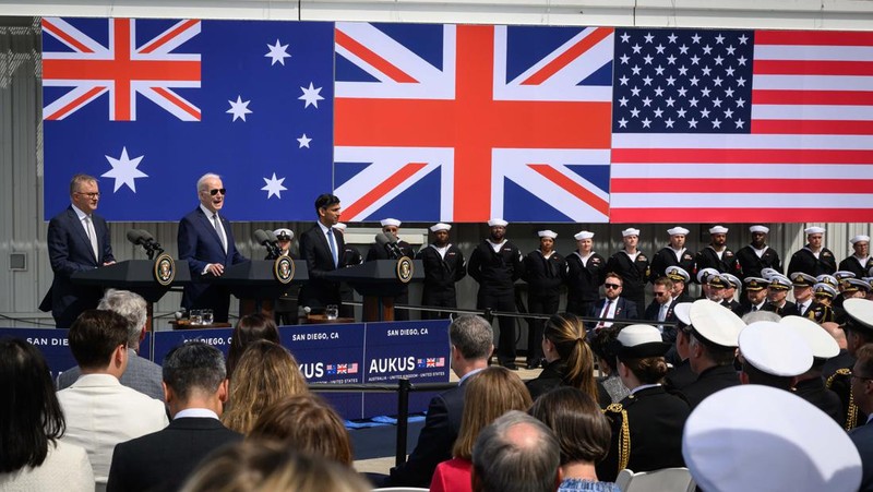 President Joe Biden arrives with Australian Prime Minister Anthony Albanese and British Prime Minister Rishi Sunak, right, for a news conference at Naval Base Point Loma, Monday, March 13, 2023, in San Diego. (AP Photo/Evan Vucci)