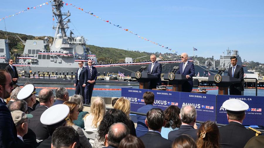 President Joe Biden arrives with Australian Prime Minister Anthony Albanese and British Prime Minister Rishi Sunak, right, for a news conference at Naval Base Point Loma, Monday, March 13, 2023, in San Diego. (AP Photo/Evan Vucci)