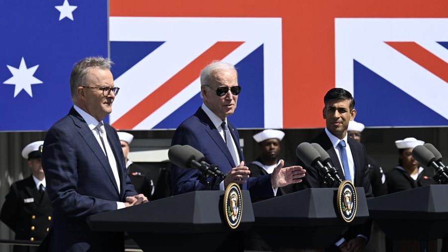 President Joe Biden, center, speaks as Australian Prime Minister Anthony Albanese, left, and British Prime Minister Rishi Sunak listen at Naval Base Point Loma, Monday, March 13, 2023, in San Diego, as they unveil, AUKUS, a trilateral security pact between Australia, Britain, and the United States. (AP Photo/Denis Poroy)