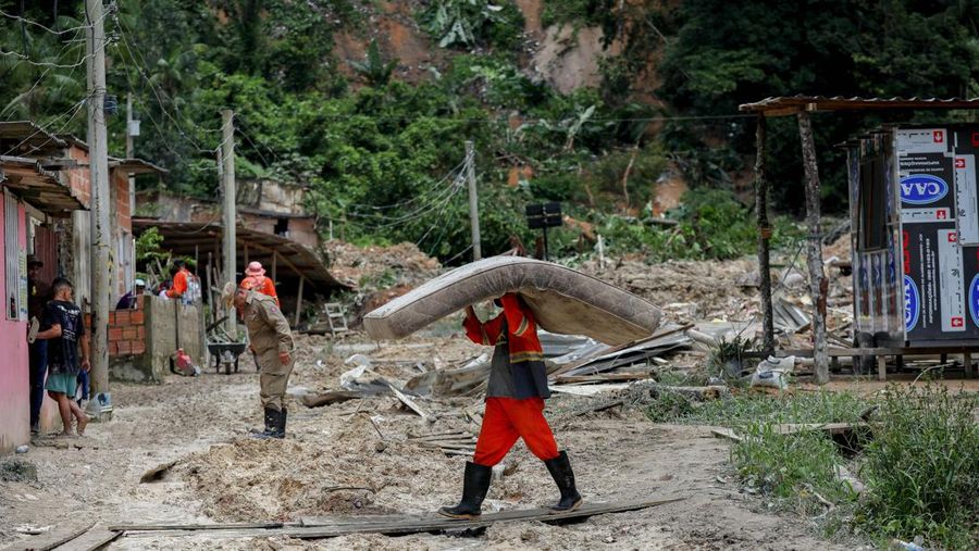 People work at the site of a deadly landslide caused by heavy rains in Manaus, Amazonas state, Brazil, March 13, 2023. REUTERS/Bruno Zanardo NO RESALES. NO ARCHIVES.