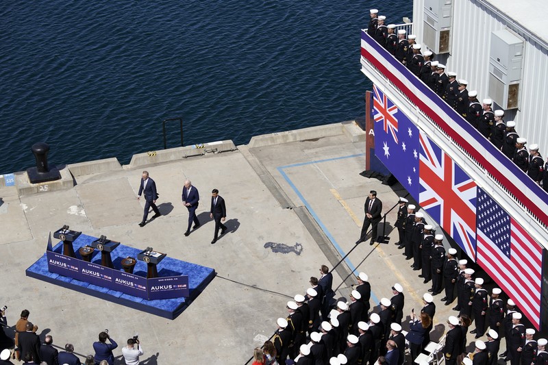 President Joe Biden arrives with Australian Prime Minister Anthony Albanese and British Prime Minister Rishi Sunak, right, for a news conference at Naval Base Point Loma, Monday, March 13, 2023, in San Diego. (AP Photo/Evan Vucci)