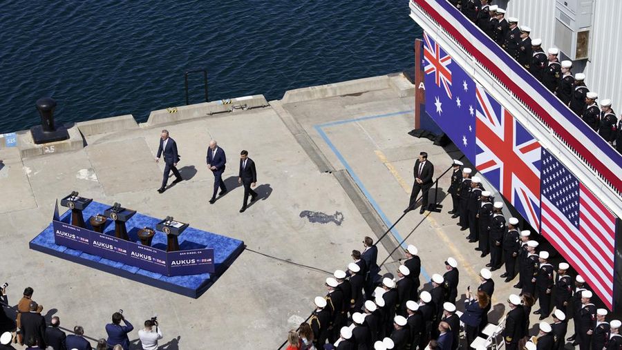 President Joe Biden arrives with Australian Prime Minister Anthony Albanese and British Prime Minister Rishi Sunak, right, for a news conference at Naval Base Point Loma, Monday, March 13, 2023, in San Diego. (AP Photo/Evan Vucci)