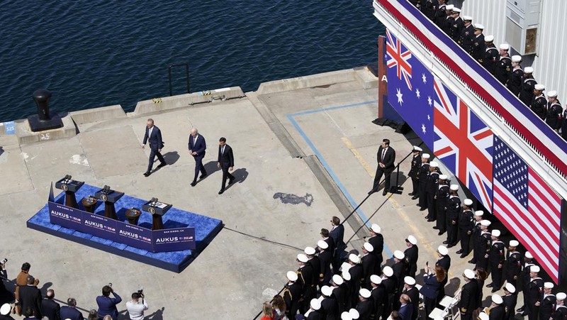 President Joe Biden arrives with Australian Prime Minister Anthony Albanese and British Prime Minister Rishi Sunak, right, for a news conference at Naval Base Point Loma, Monday, March 13, 2023, in San Diego. (AP Photo/Evan Vucci)