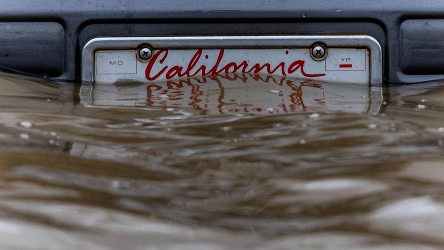 A California plate is seen at an area affected by floods after days of heavy rain in Pajaro, California, U.S., March 14, 2023. REUTERS/Carlos Barria     TPX IMAGES OF THE DAY