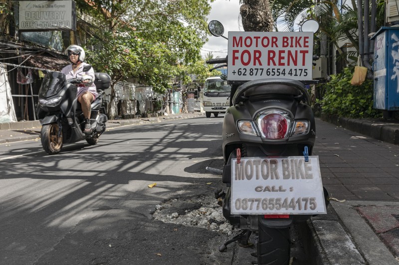 Sings for motorbike rental service in Seminyak, Bali, Indonesia, on Thursday, March 16, 2023. Foreign tourists in Bali wont be allowed to use motorcycles to get around the island after a string of accidents led to injuries and even deaths. Photographer: Nyimas Laula/Bloomberg via Getty Images