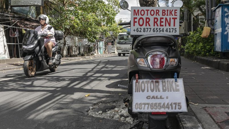 Sings for motorbike rental service in Seminyak, Bali, Indonesia, on Thursday, March 16, 2023. Foreign tourists in Bali wont be allowed to use motorcycles to get around the island after a string of accidents led to injuries and even deaths. Photographer: Nyimas Laula/Bloomberg via Getty Images