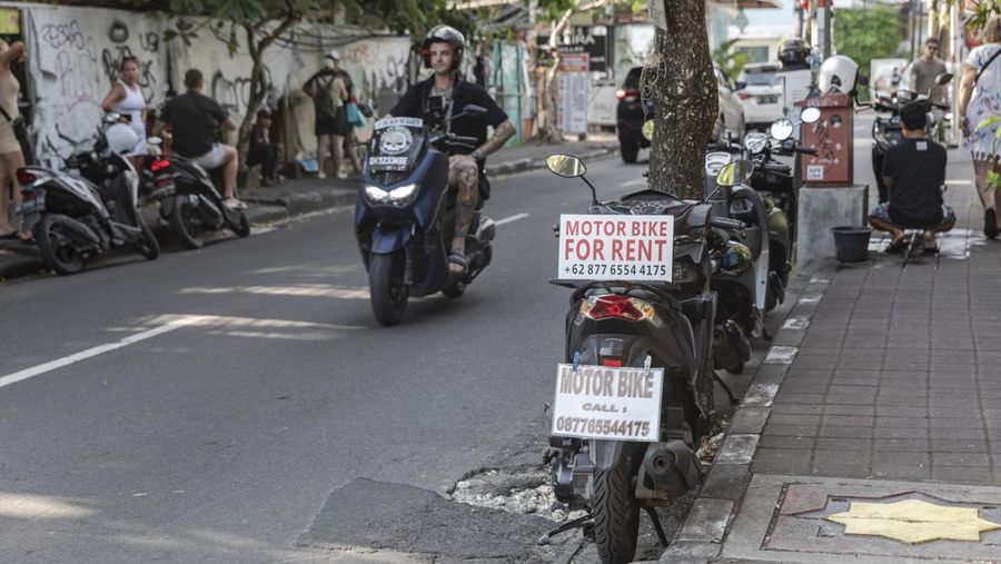 Signs for motorbike rental service in Seminyak, Bali, Indonesia, on Wednesday, March 15, 2023. Foreign tourists in Bali wont be allowed to use motorcycles to get around the island after a string of accidents led to injuries and even deaths. Photographer: Nyimas Laula/Bloomberg via Getty Images