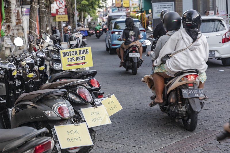 Sings for motorbike rental service in Seminyak, Bali, Indonesia, on Thursday, March 16, 2023. Foreign tourists in Bali wont be allowed to use motorcycles to get around the island after a string of accidents led to injuries and even deaths. Photographer: Nyimas Laula/Bloomberg via Getty Images