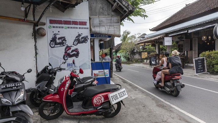 1248413785 A sign for motorbike rental service in Canggu, Bali, Indonesia, on Thursday, March 16, 2023. Foreign tourists in Bali wont be allowed to use motorcycles to get around the island after a string of accidents led to injuries and even deaths. Photographer: Nyimas Laula/Bloomberg via Getty Images
