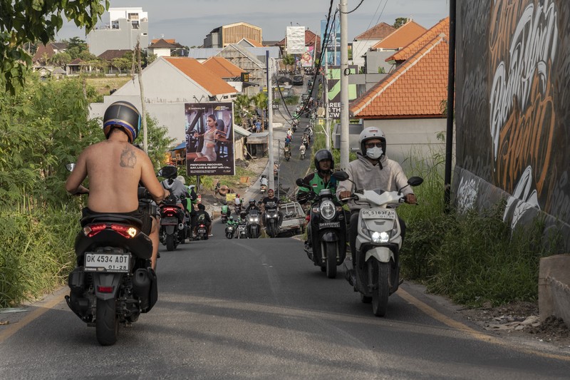 1248363999 Sings for motorbike rental service in Seminyak, Bali, Indonesia, on Thursday, March 16, 2023. Foreign tourists in Bali wont be allowed to use motorcycles to get around the island after a string of accidents led to injuries and even deaths. Photographer: Nyimas Laula/Bloomberg via Getty Images