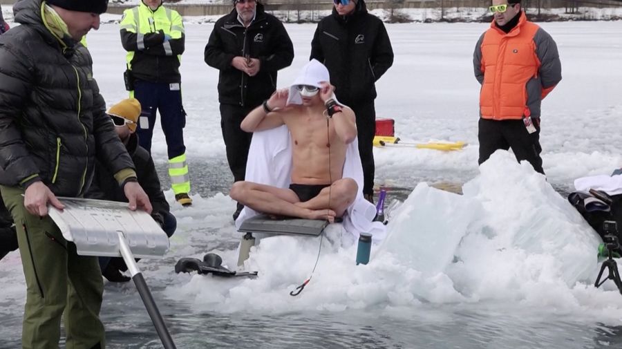Czech freediver David Vencl dives to 52 metres under the ice of Lake Sils in one breath and wearing only a swimsuit in this picture taken from a video in Sils near St. Moritz, Switzerland March 14, 2023. David Vencl Organisation/Handout via REUTERS THIS IMAGE HAS BEEN SUPPLIED BY A THIRD PARTY. NO RESALES. NO ARCHIVES