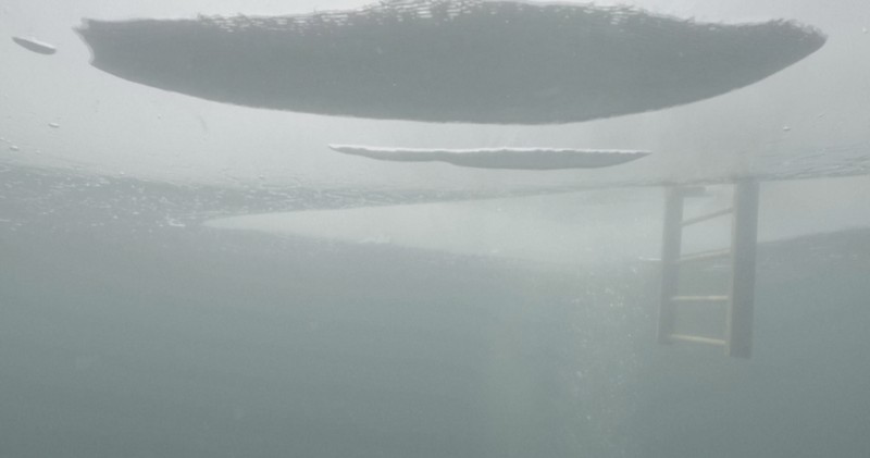 Czech freediver David Vencl dives to 52 metres under the ice of Lake Sils in one breath and wearing only a swimsuit in this picture taken from a video in Sils near St. Moritz, Switzerland March 14, 2023. David Vencl Organisation/Handout via REUTERS THIS IMAGE HAS BEEN SUPPLIED BY A THIRD PARTY. NO RESALES. NO ARCHIVES