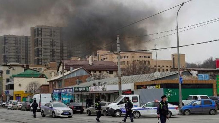 Smoke from fire rises above a building of Russia's Federal Security Services (FSB) in the southern city of Rostov-on-Don on March 16, 2023. - One person was killed and two were injured on March 16, 2023 when a fire tore through security service offices in a southern region of Russia bordering Ukraine, Russian news agencies reported. (Photo by STRINGER / AFP)