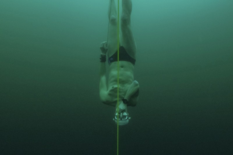 Czech freediver David Vencl dives to 52 metres under the ice of Lake Sils in one breath and wearing only a swimsuit in this picture taken from a video in Sils near St. Moritz, Switzerland March 14, 2023. David Vencl Organisation/Handout via REUTERS THIS IMAGE HAS BEEN SUPPLIED BY A THIRD PARTY. NO RESALES. NO ARCHIVES