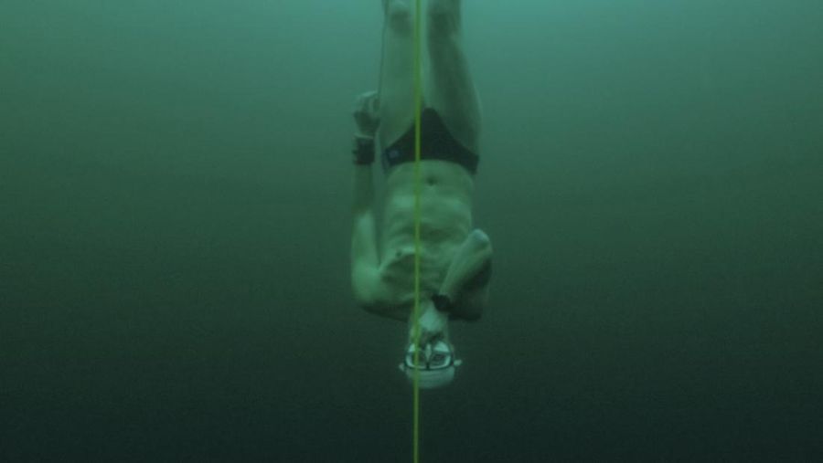 Czech freediver David Vencl dives to 52 metres under the ice of Lake Sils in one breath and wearing only a swimsuit in this picture taken from a video in Sils near St. Moritz, Switzerland March 14, 2023. David Vencl Organisation/Handout via REUTERS THIS IMAGE HAS BEEN SUPPLIED BY A THIRD PARTY. NO RESALES. NO ARCHIVES