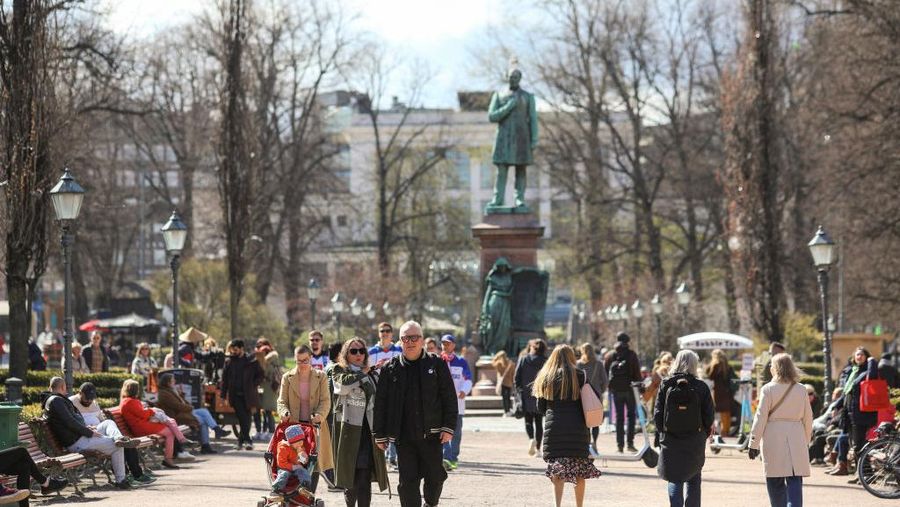 HELSINKI, UUSIMAA, FINLAND - 2022/05/15: People have a picnic in front of cherry blossoms during the Sakura festival. Every year in May, Sakura festival of Japanese culture takes place in Helsinki in Roihuvuori Cherry Park. (Photo by Takimoto Marina/SOPA Images/LightRocket via Getty Images)
