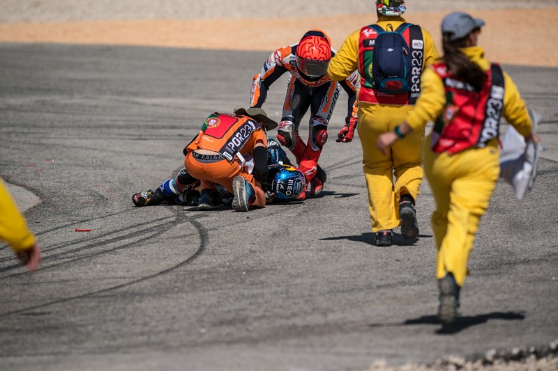 MotoGP - Portuguese Grand Prix - Algarve International Circuit, Portimao, Portugal - March 26, 2023 Repsol Honda Team's Marc Marquez and CryptoDATA RNF MotoGP Team's Miguel Oliveira after crashing during the race REUTERS/Marcelo Del Pozo     TPX IMAGES OF THE DAY