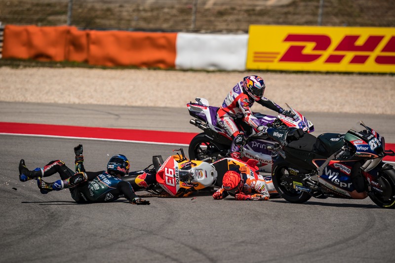 MotoGP - Portuguese Grand Prix - Algarve International Circuit, Portimao, Portugal - March 26, 2023 Repsol Honda Team's Marc Marquez and CryptoDATA RNF MotoGP Team's Miguel Oliveira after crashing during the race REUTERS/Marcelo Del Pozo     TPX IMAGES OF THE DAY